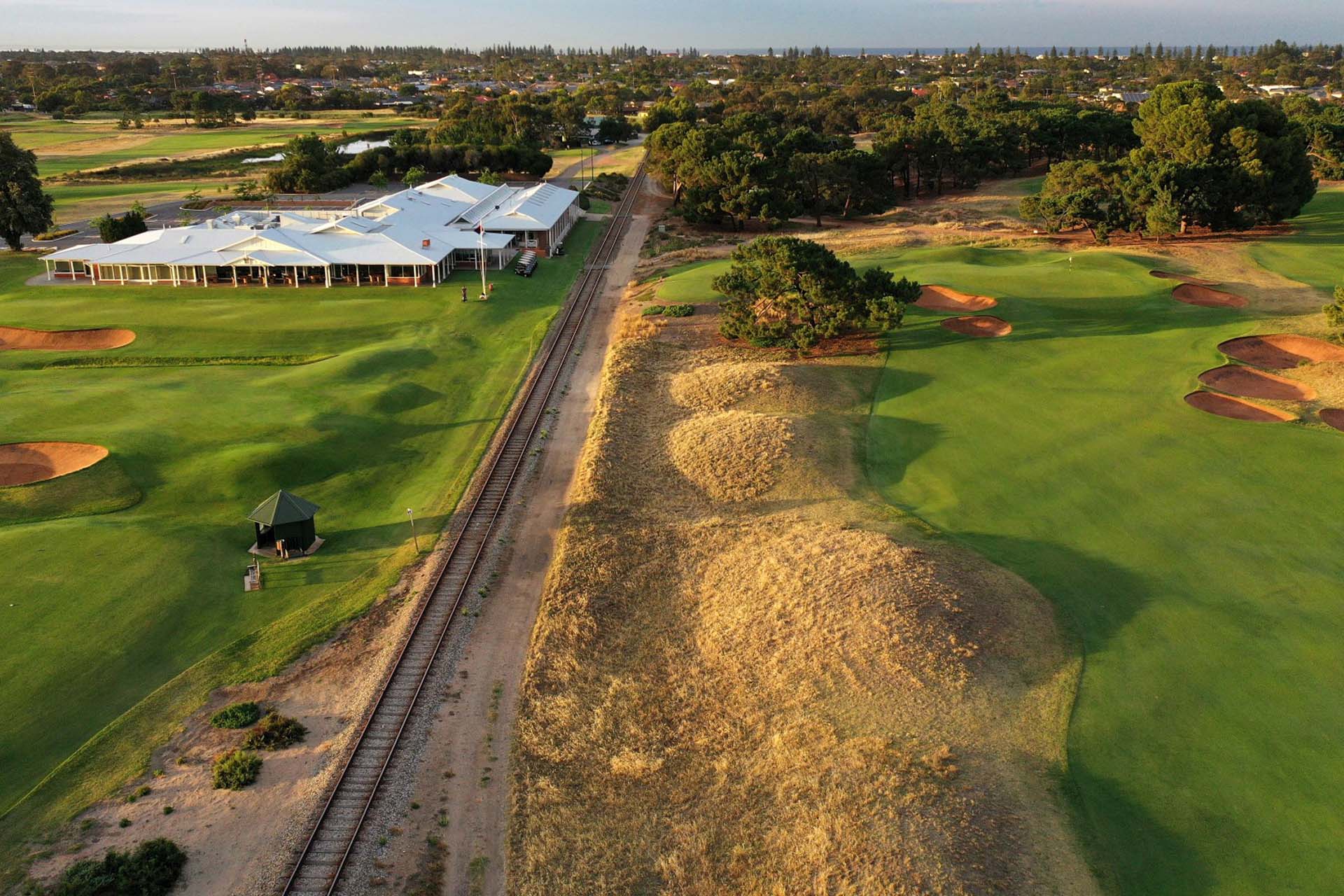 Royal Adelaide Golf Club - Par 5, 2nd Hole, Railway Line & Clubhouse / Photo: Gary Lisbon Golf Photography